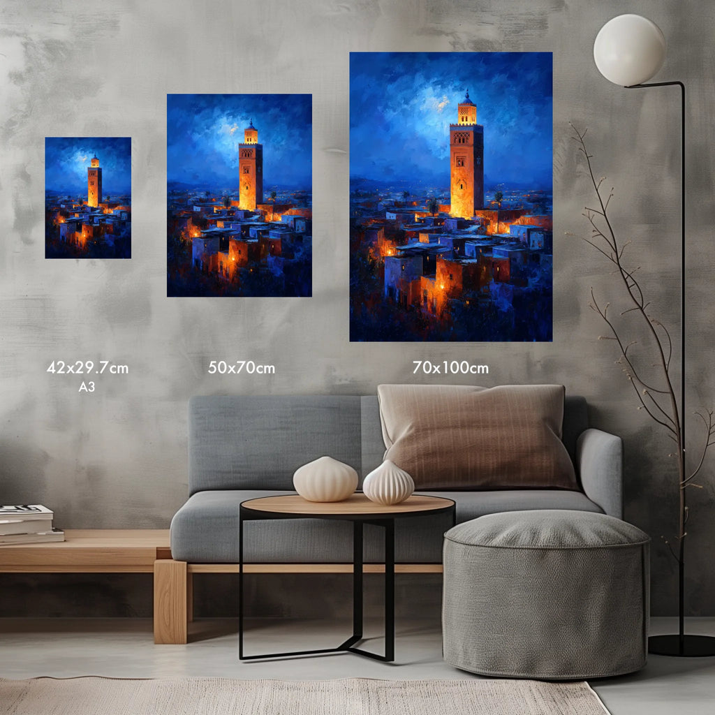 Visual size comparison guide for Marrakech poster art, showing A3, 50x70 cm, and 70x100 cm sizes mounted on a concrete wall above a grey sofa, emphasizing a dark, minimalist living room aesthetic.